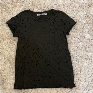 dark green t-shirt with black spots